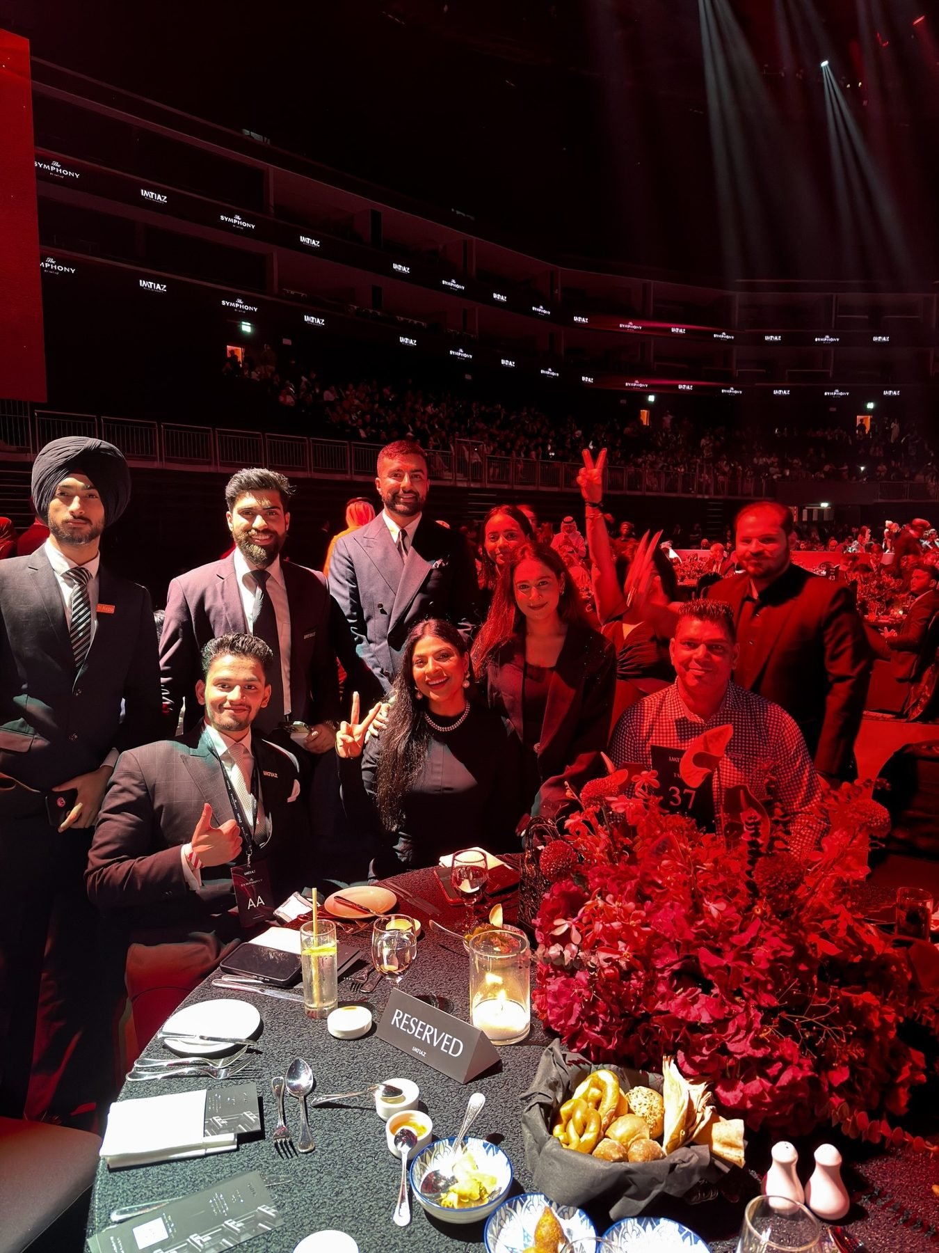 Shah Hussain and the Imtiaz Developments team seated at a table at The Symphony by Imtiaz launch event in Dubai